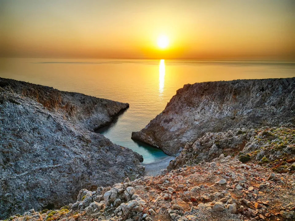 Aerial drone shot of Seitan Limania cove between limestone cliffs, vivid turquoise water, north Crete